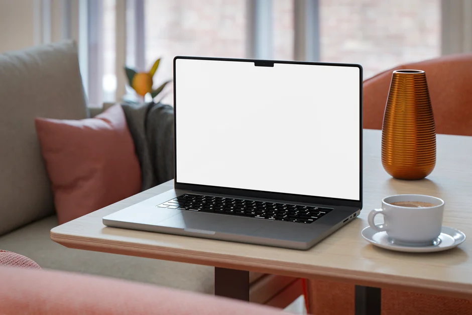 A sleek office desk setup featuring Apple devices: iMac, MacBook, and iPad.